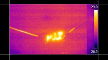 Infrared (heat) image shows a heating device made from steam-cracked tar, annealed with a laser, which  was formed into an MIT logo to demonstrate the controllability of the process. Image: Courtesy of the researchers
