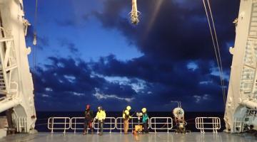 Scientists prepare to deploy an underway CTD from the back deck of a research vessel.Image: Amala Mahadevan