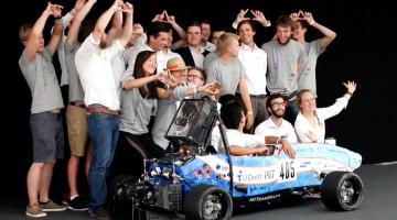 MIT Driverless and TU Delft pose with their race car, DUT19, at Formula Student Germany 2019. The joint team placed third overall.Photo: Delft Driverless
